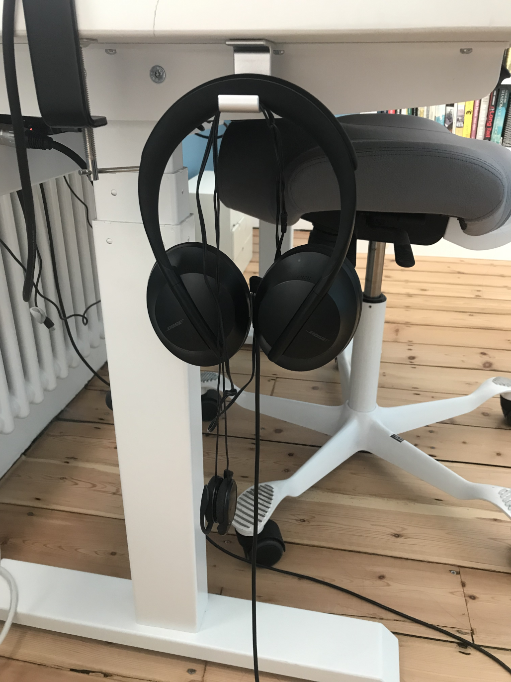 two headphones hanging on a hook